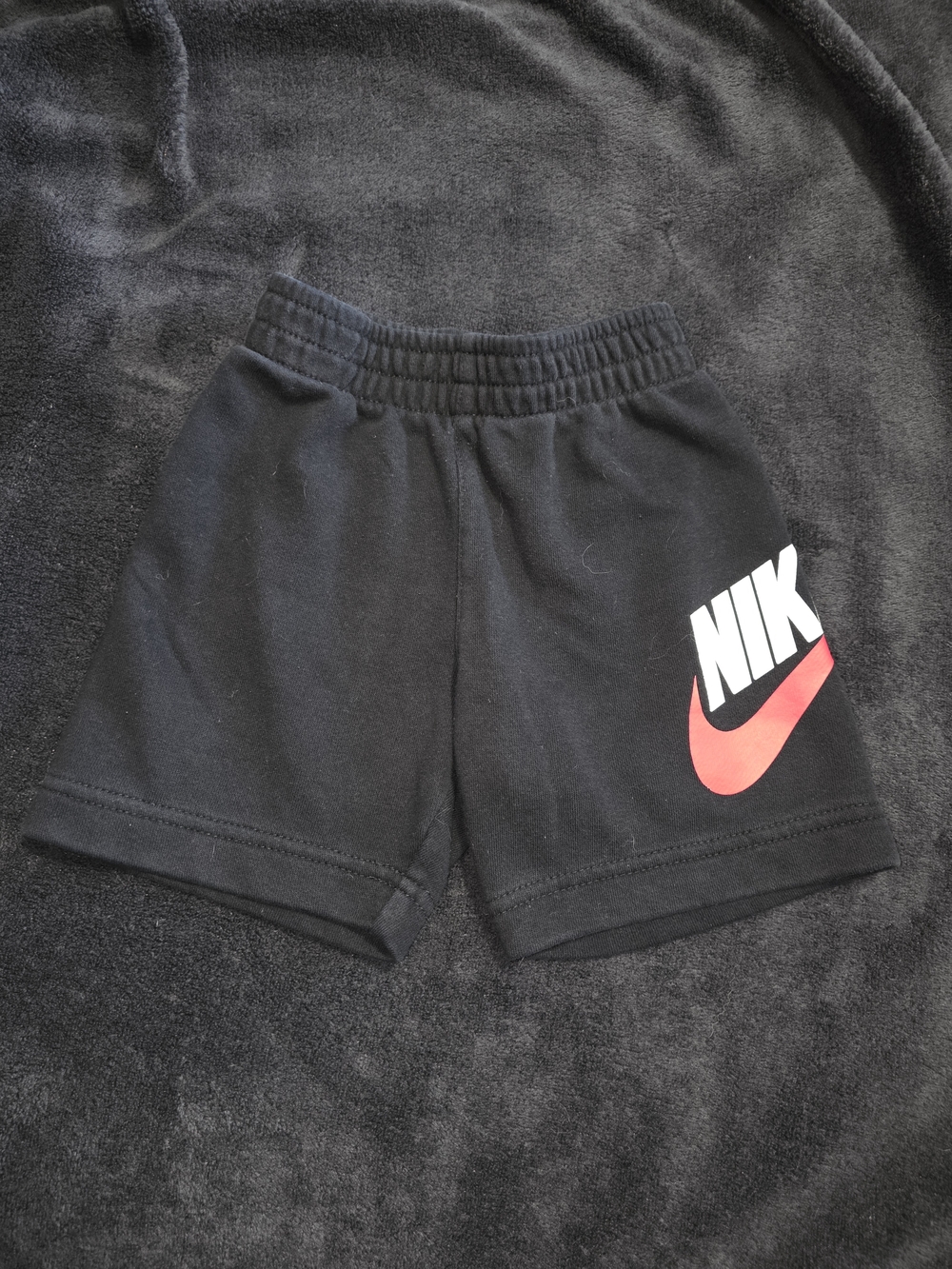 Nike Black Kids Shorts with Red Swoosh and White Logo